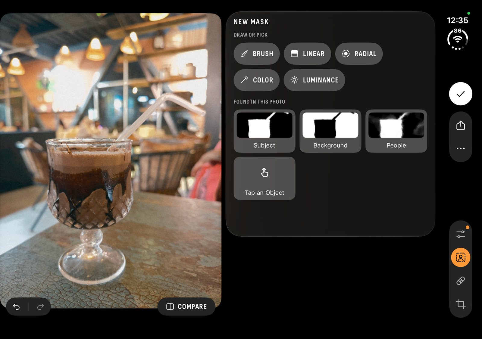 Masks on an open iPhone Duo: subject, background and people found in a photo of iced coffee