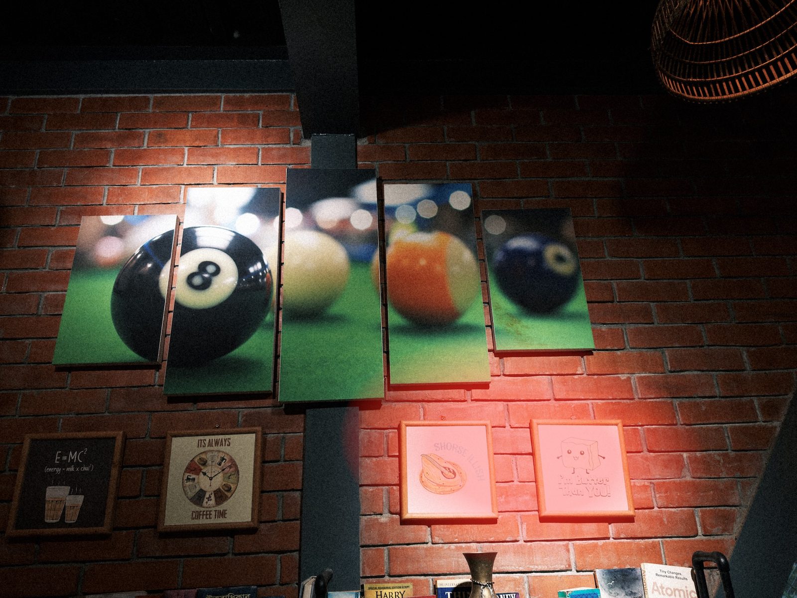 The wall photo with a red oval over the bright area around the framed pictures